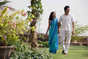 69306261-young-couple-strolling-in-garden